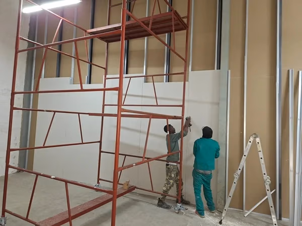 Drywall partition installation in progress